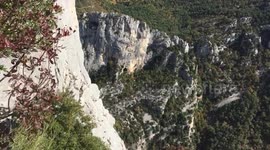 The climbers are filming a beautiful view of the canyon and vautours flying around.