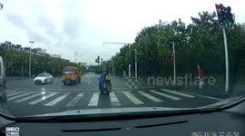 Chinese girl kicked by parent after falling off scooter on road in China