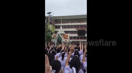 Thai students raise 'Hunger Games' three-finger salute at flag ceremony