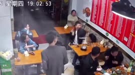 Stray cat falling from ceiling scares diners in restaurant in Shanghai
