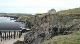 Workmen risk lives trying to stabilise crumbling cliff face on Cornwall coast