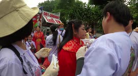 Walk around festival where religious devotees pierce their cheeks with skewers