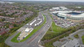 Britain's bravest funfair sets up for half-term holidays - just yards away from a Covid-19 testing centre