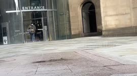 Man with balaclava circles Manchester town hall