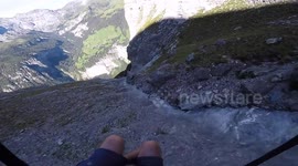 The way this speed flyer skims this cliffside will have you biting your nails