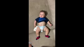 Adorable baby boy bursts into contagious laughter when tickled by his dad