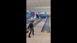 kid play bowling