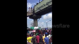 Nigerians gather to protest against police brutality despite 24-hour curfew