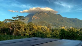 Timelapse shows 'hat' clouds over mountains during cooler weather in Thailand