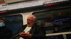 Funny man singing on the london underground