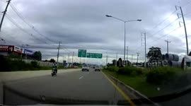 Huge piece of wood flies off truck into woman's car in Thailand
