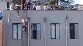 Woman seen using ladder to escape Bank of Georgia hostage situation