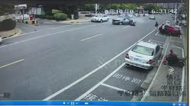 Out of control car reverses into biker as motorist presses accelerator by mistake in China