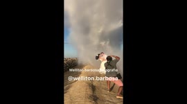 Mesmerizing wedding photoshoot finishes with plane dropping water on newlyweds