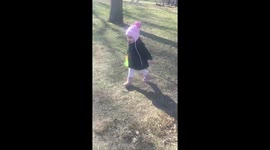 little girl runs into her mommy's arms and into a big hug that knocks them both over