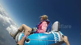 Amazing footage shows the moment a daredevil skydiver leapt from a plane sitting in a inflatable pool tube