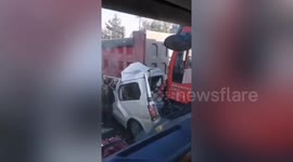 Motorists miraculously survive after vehicle crushed in between two trucks in China