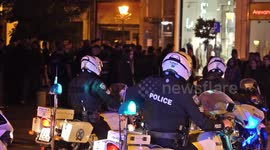 Greek police clear groups of revellers from squares
