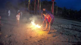 Children let off firecrackers at vegetarian festival in Thailand