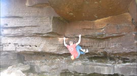 Crazy gymnastic rock climbing on Yorkshire cliff overhang