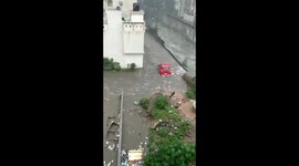 Floods in India's Karnataka sees vehicles swept away and houses left in ruins