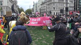 UK protesters depict President Trump injecting hormones into pantomime cow