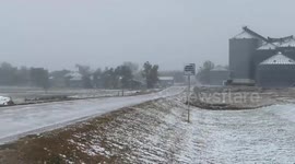 Early winter snow falls over central South Dakota in unseasonably cold weather