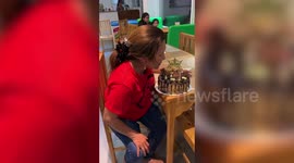 Children surprise their mother with new phone hidden in birthday cake