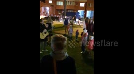 Neighbours hold a concert in their yard to support Belarusian protesters
