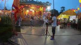 Devotees worship at beautiful shrine at Phuket Vegetarian Festival