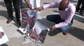 Gaza protesters burn pictures of French President Macron