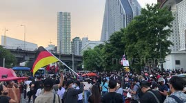 Thai pro-democracy protesters wave German flags as they march to embassy in Bangkok