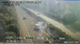 Car smashed into by truck after it attempted to change lane on Chinese highway