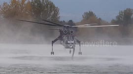 Sikorsky S64 tanker aircraft filling water tank in Boulder Colorado 2020