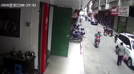 Helmet saves biker's life after water pipe falls from building onto his head in China