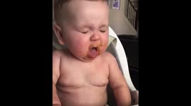 'You're being a little dramatic!' Baby retches after trying mashed peas