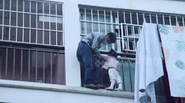 Chinese neighbour holds toddler trapped on building ledge before firefighters arrive