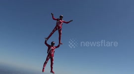 Synchronized skydiving duo perform sensational routine mid-air in France