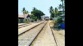 Crossing train tracks to the beach Colombo SL