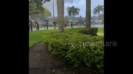 Long lines in the pouring rain on the first day of early voting in Florida
