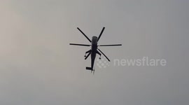 Air tanker helicopter returning to replenish water tank
