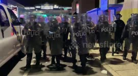 Riot police push back crowds of protesters during unrest in Philadelphia