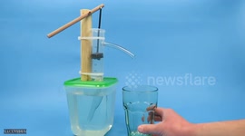 YouTuber builds mini DIY hand pump from wood and a syringe