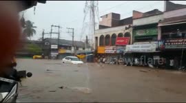 India flood inundates sari shop with water, and bargain hunters