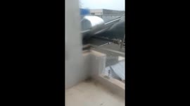 Strong winds brought by Typhoon Molave rip building roofs off in Vietnam