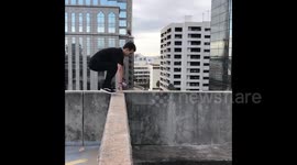 Death-defying backflip on a tall building in Florida