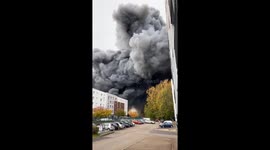 Thick smoke pours out of abandoned warehouse on fire in France's Le Havre