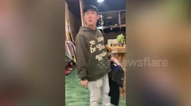 Rude Chinese shopkeeper throws out couple not wanting to pay 'testing fee'