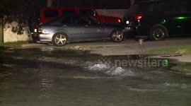 Water Main Break Cracks Roadway and Floods Three City Blocks