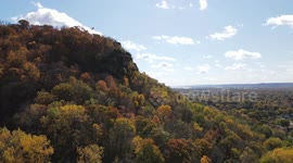 An American flag on top of Granddads Bluff in La Crosse, Wisconsin during autumn